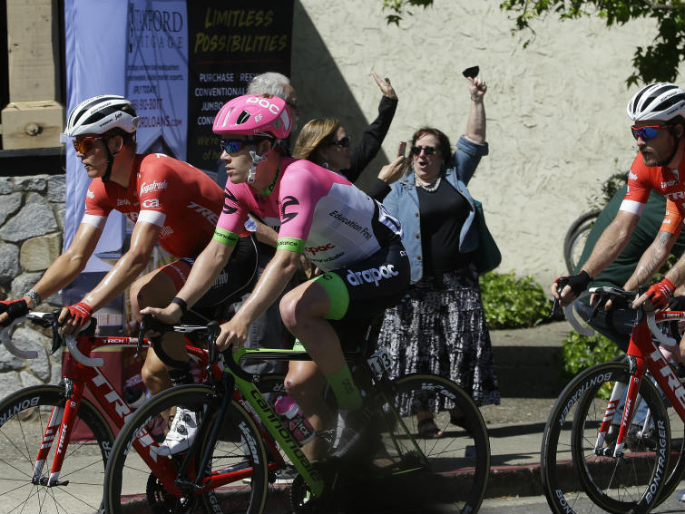 Cyclists are cheered on as they race through Placerville, Calif., during the sixth stage of the Amgen Tour of California cycling race, Friday, May 18, 2018. 